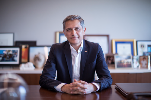 Joe Kiani, Founder and of Masimo sitting at a desk