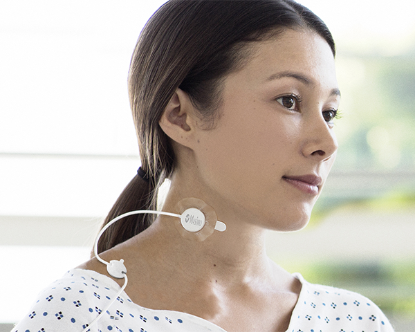 Patient wearing Masimo Respiration Rate sensor on neck.